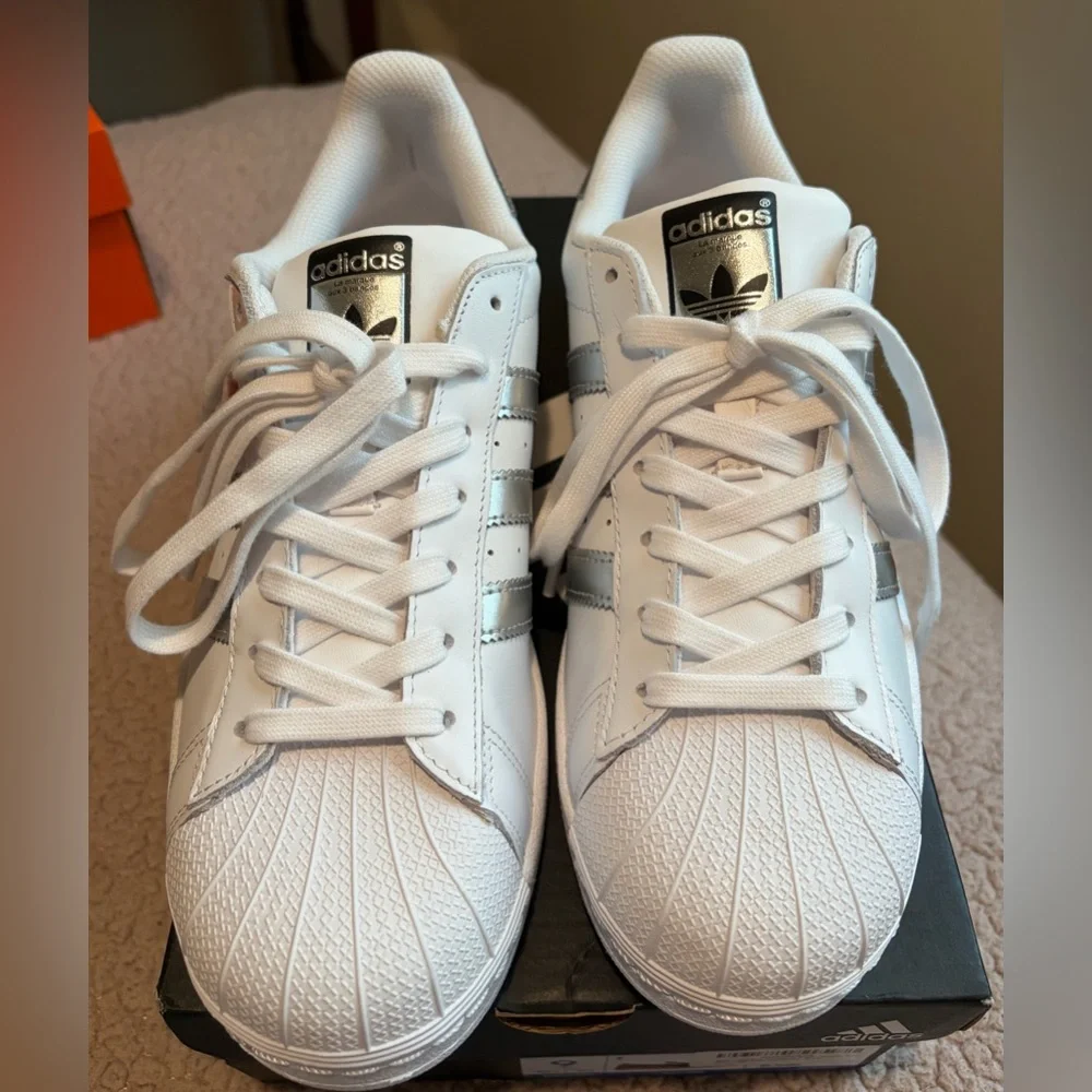 Brand New Ladies Adidas White Sneakers with Metallic Silver Accents.